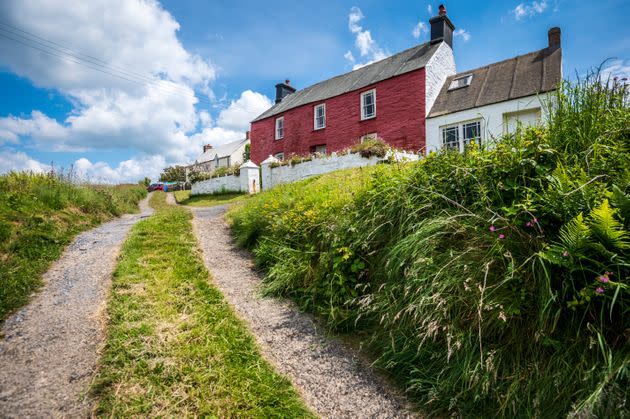 Colourful coastal cottages in Pembrokeshire (Photo: C T Aylward via Getty Images)