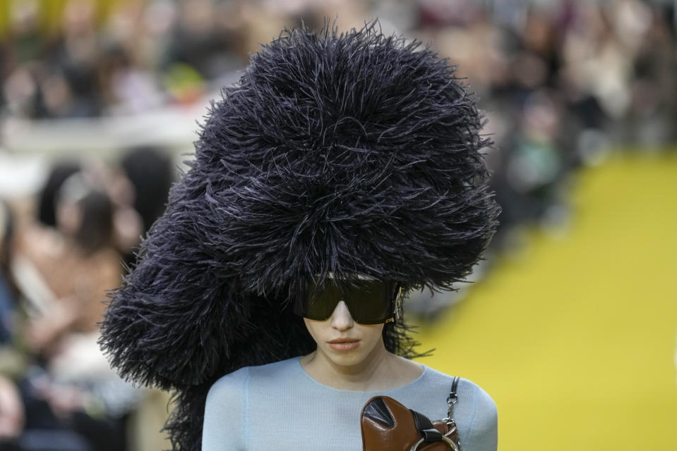 A model wears a creation as part of the Gucci women's Fall-Winter 2023-24 collection presented in Milan, Italy, Friday, Feb. 24, 2023. (AP Photo/Antonio Calanni)