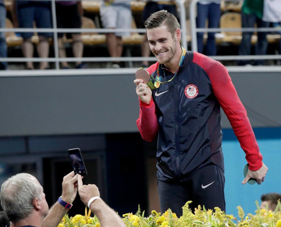 David Boudia celebrates winning the bronze medal in the men's 10m platform diving event during the 2016 Rio 2016 Summer Olympic Games at Maria Lenk Aquatics Centre.