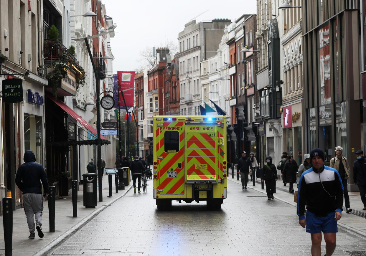 An ambulance drives down Grafton Street in Dublin's city centre as a nationwide lockdown remains in place. The last week of January saw 317 deaths linked to Covid-19, more than 10% of all deaths up to that point. New data from the Central Statistics Office (CSO) shows that more than 250 people died of the virus every week in the three weeks up to January 29. Picture date: Friday February 5, 2021.