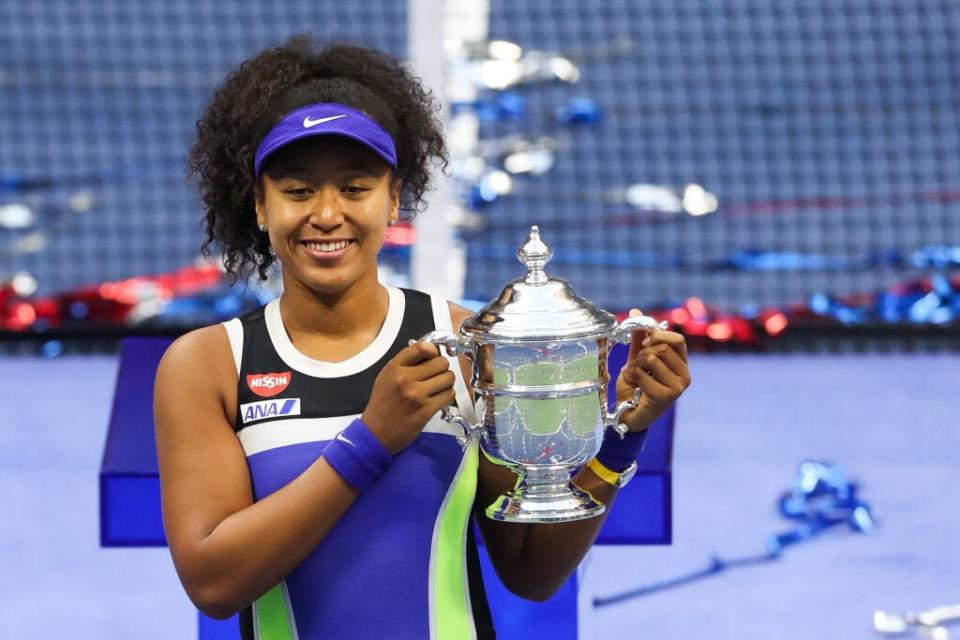 Naomi Osaka of Japan celebrates with the trophy after winning her Women’s Singles final match against Victoria Azarenka of Belarus on Day Thirteen of the 2020 US Open at the USTA Billie Jean King National Tennis Center on September 12, 2020 in the Queens borough of New York City. (Photo by Matthew Stockman/Getty Images)