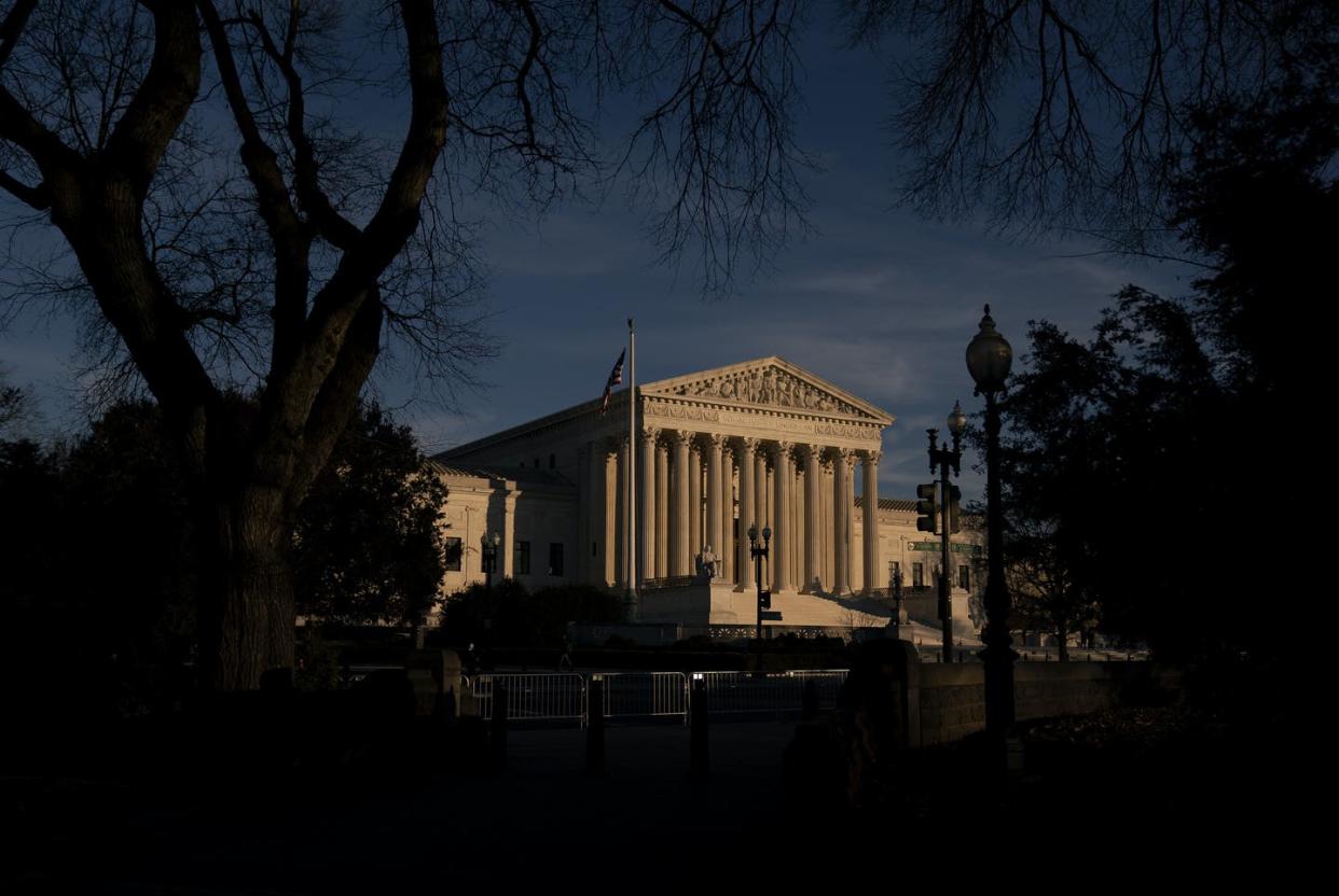 <span class="caption">Political pressure is focusing on the makeup of the U.S. Supreme Court.</span> <span class="attribution"><a class="link " href="https://www.gettyimages.com/detail/news-photo/the-u-s-supreme-court-stands-on-december-11-2020-in-news-photo/1230073841" rel="nofollow noopener" target="_blank" data-ylk="slk:Stefani Reynolds/Getty Images;elm:context_link;itc:0;sec:content-canvas">Stefani Reynolds/Getty Images</a></span>