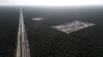 A line of the Mayan Train is built using material dug out from the nearby tropical forest near Playa del Carmen, Mexico, Friday, March 1, 2024. When it's completed, the high-speed Maya Train will wind around Mexico's southern Yucatan peninsula. (AP Photo/Rodrigo Abd)