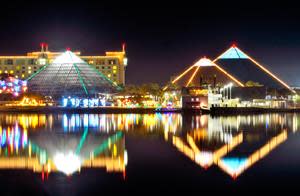 Moody Gardens Pyramids decked in lights for the holidays from across the water.