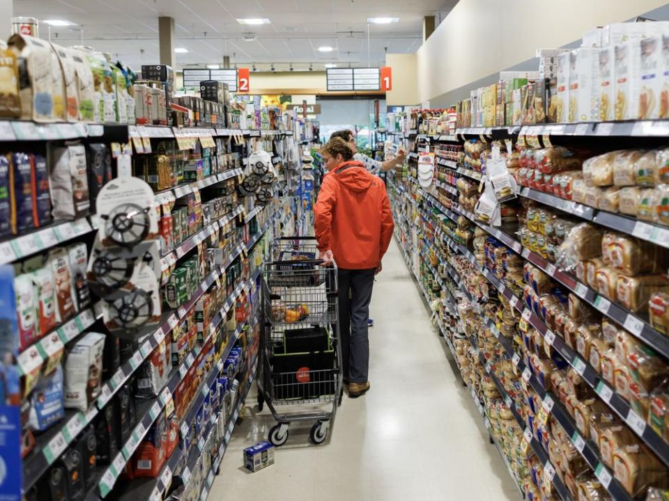  People shop inside a grocery store in Toronto.