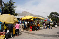 Street vendors sell fruit and vegetables outside Paradero 4 market, located near Nueva Union shantytown, in Villa Maria del Triunfo district of Lima, Peru, May 23, 2018. REUTERS/Mariana Bazo