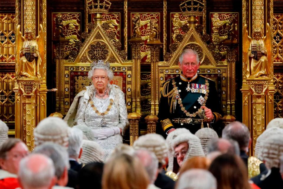 Queen Elizabeth II takes her seat on the The Sovereign's Throne in the House of Lords next to Prince Charles, before reading the Queen's Speech during the State Opening of Parliament in 2019 (POOL/AFP via Getty Images)