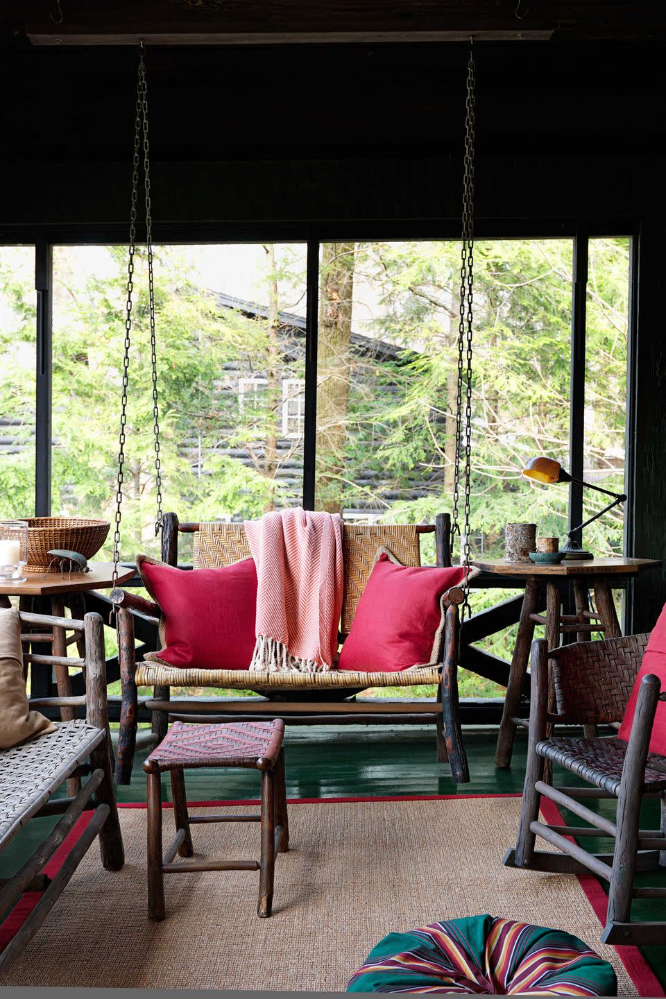 rustic screened porch with hickory furniture