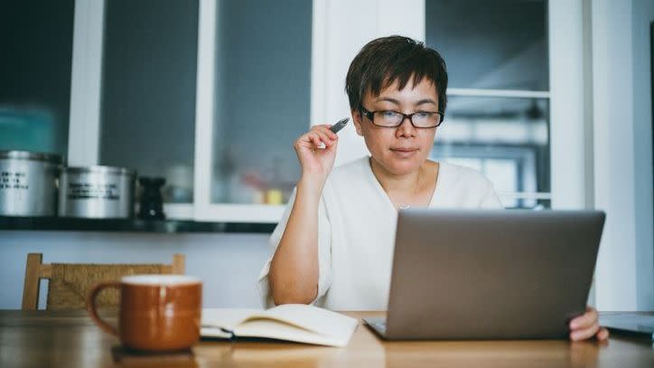 A woman looks over her retirement accounts and considers doing a Roth conversion. 