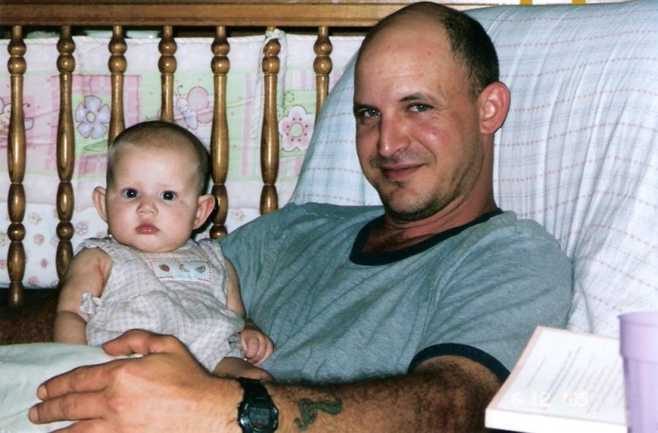 Adam Attebury holds his niece Emma. Attebury died Feb. 14 after being hit by a driver who has been charged with intoxication manslaughter.