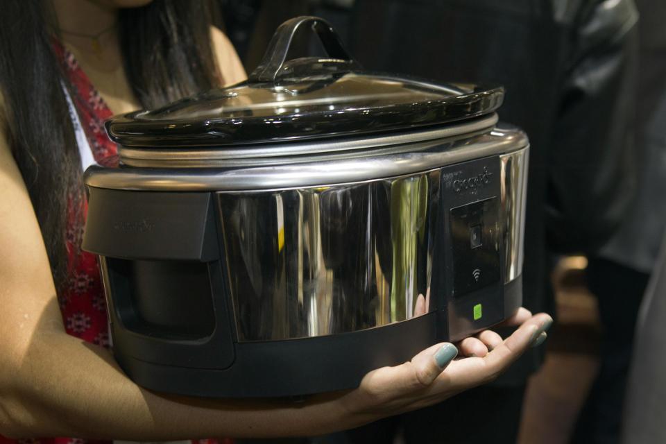 A Belkin Crock-Pot WeMo Smart Slow Cooker ($99.99) is displayed during "CES Unveiled," a media preview event to the annual Consumer Electronics Show (CES), in Las Vegas, Nevada, January 5, 2014. The crock-pot can be controlled remotely via a smartphone. The appliance should be available in March, a representative said. (REUTERS/Steve Marcus)