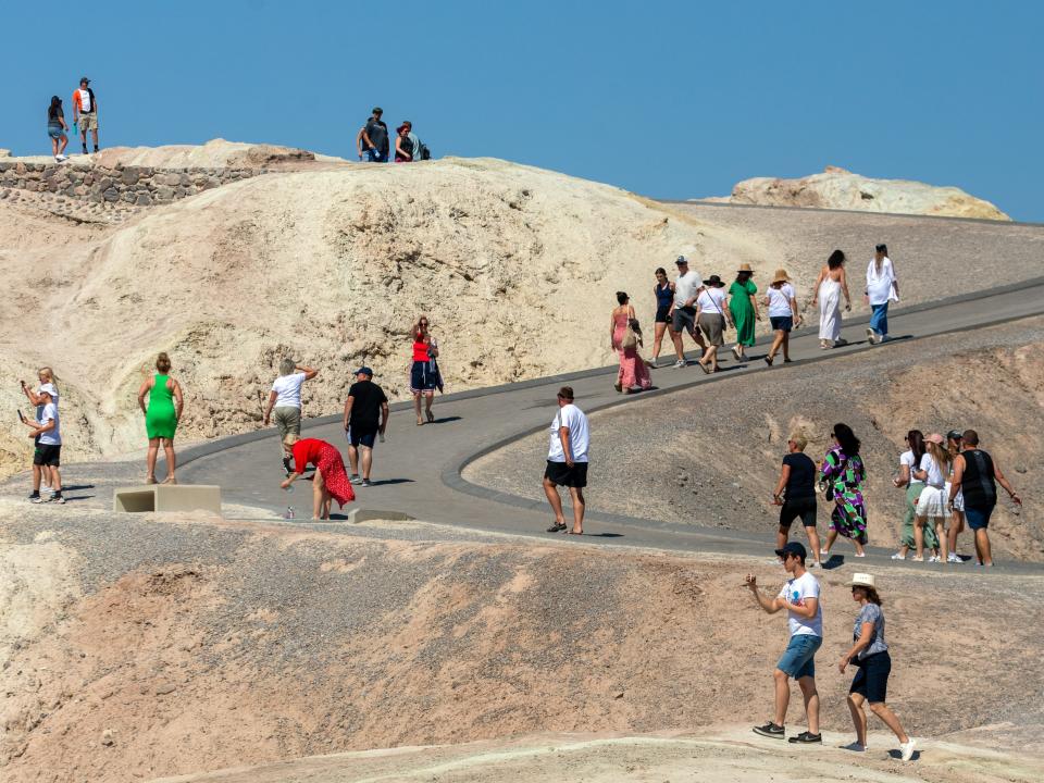 A bus filled with visitors from Poland stopped at Zabriskie Point in Death Valley National Park on Tuesday, July 18, 2023, in Death Valley, California.
