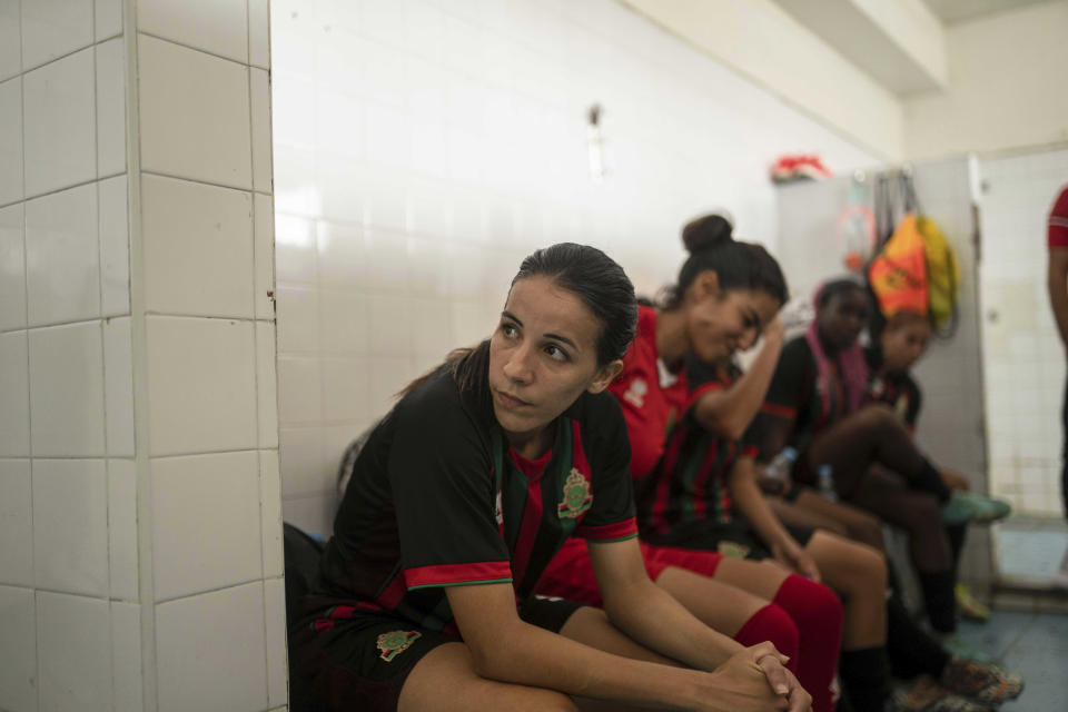 Women players of ASFAR soccer team take a half-time break during a match against ASDCT Ain Atiq, in Morocco's professional women league, in Rabat, Morocco, Wednesday, May 17, 2023. (AP Photo/Mosa'ab Elshamy)