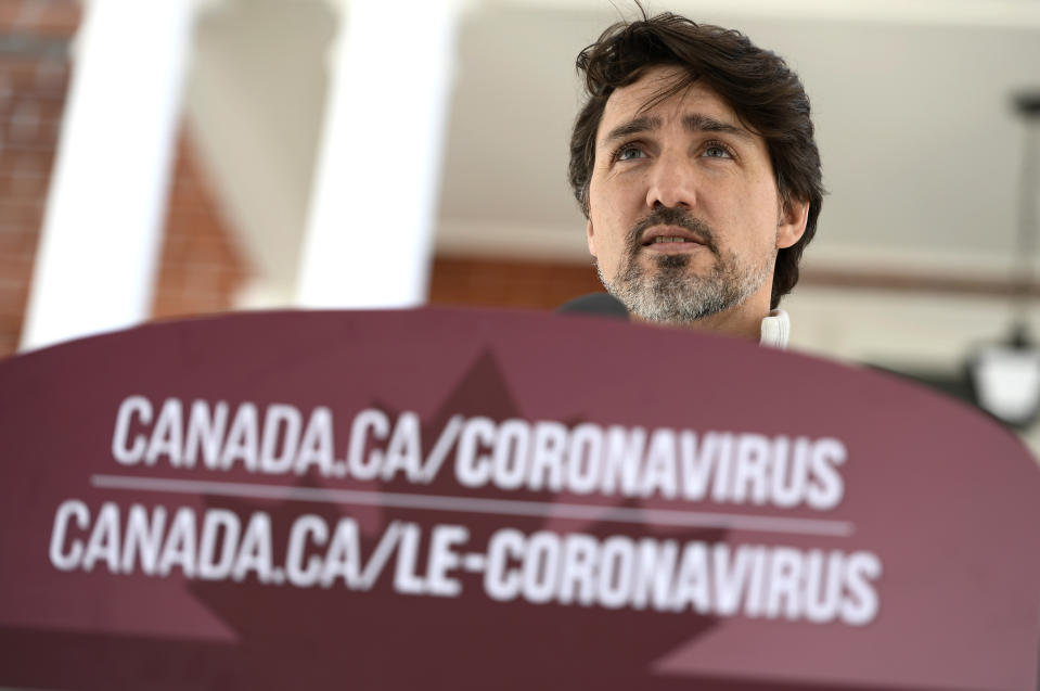 Canadian Prime Minister Justin Trudeau speaks during his daily press conference on the COVID-19 pandemic, in front of his residence at Rideau Cottage, in Ottawa, Ontario, on Saturday, April 18, 2020. (Justin Tang/The Canadian Press via AP)