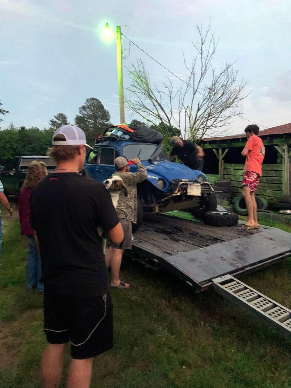 Arkansans load up Mark Girdner's Baja Bug after it was rescued from the river at Natural Dam, Arkansas. Zane Pittman came down from Northwest Arkansas to help pull the Bug from the water.