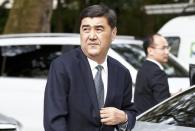 Nuer Bekri, China's Director of National Energy Administration arrives outside 10 Carlton House Terrace in central London, where representatives from Britain, China, France and energy company EDF will sign an agreement to build and operate a new nuclear power station at Hinkley Point, Britain, September 29, 2016. REUTERS/Peter Nicholls