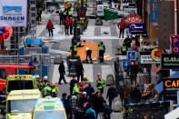 <p>APR. 7, 2017 – Emergency services work at the scene where a truck crashed into the Ahlens department store at Drottninggatan in central Stockholm, Sweden.<br> (Photo: Jonathan Nackstrand/AFP/Getty Images) </p>