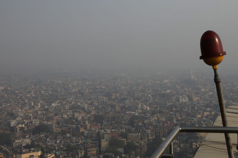 Buildings are seen shrouded in smog in New Delhi