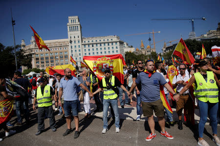 People take part in demonstration in support of the Spanish police units who took part in the operation to prevent the independence referendum in Catalonia on October 1, 2017, in Barcelona, Spain, September 29, 2018. REUTERS/Jon Nazca
