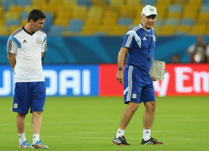 Alejandro Sabella instructs Lionel Messi during practice at Maracana Stadium on Saturday. (Getty Images)
