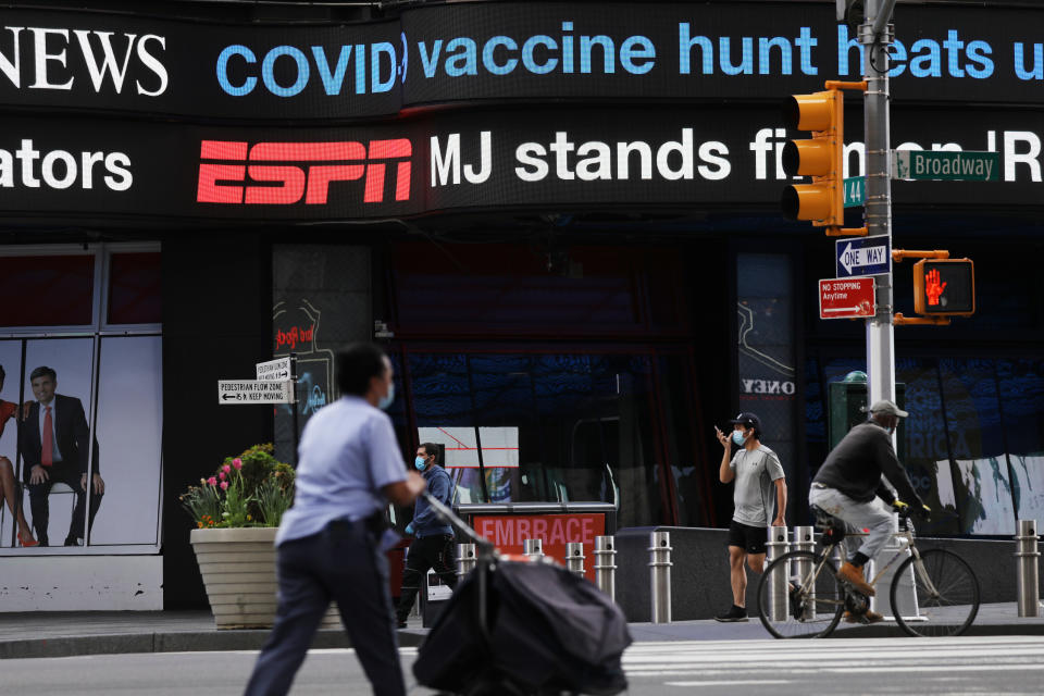 NEW YORK, NY - MAY 04: People walk through an empty Times Square on May 04, 2020 in New York City. Hospitals in New York are beginning to see a drop in news coronavirus cases as New York continues to be one of the global centers of the COVID-19 outbreak (Photo by Spencer Platt/Getty Images)