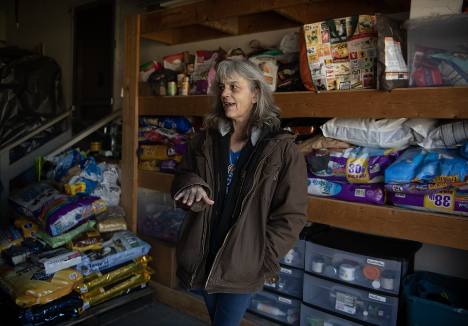 Rene Lamp in the garage where she stores donated pet-related items.