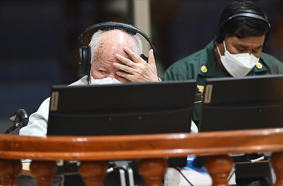 In this photo released by the Extraordinary Chambers in the Courts of Cambodia, Khieu Samphan, left, the former head of state for the Khmer Rouge, sits in a courtroom during a hearing at the U.N.-backed war crimes tribunal in Phnom Penh, Cambodia, Thursday, Sept. 22, 2022. The international court convened in Cambodia to judge the Khmer Rouge for its brutal 1970s rule ended its work Thursday after spending $337 million and 16 years to convict just three men of crimes after the regime caused the deaths of an estimated 1.7 million people. (Nhet Sok Heng/Extraordinary Chambers in the Courts of Cambodia via AP)