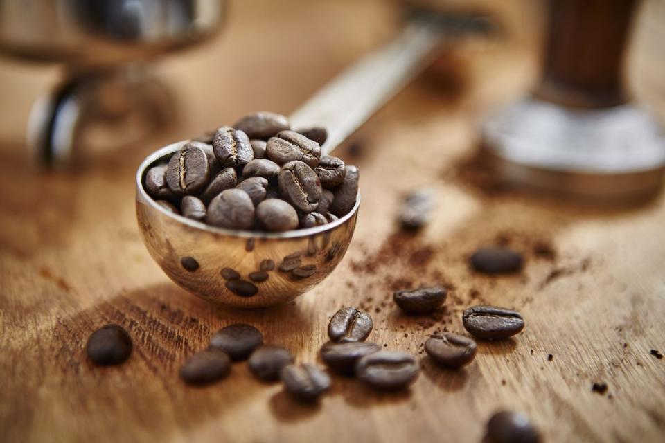coffee beans in measuring cup