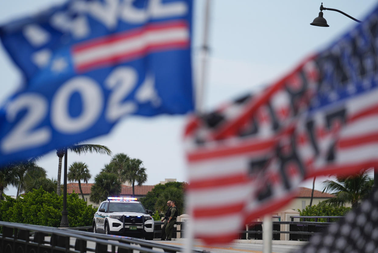 Officers stand watch on a bridge near Donald Trump’s Mar-a-Lago estate.