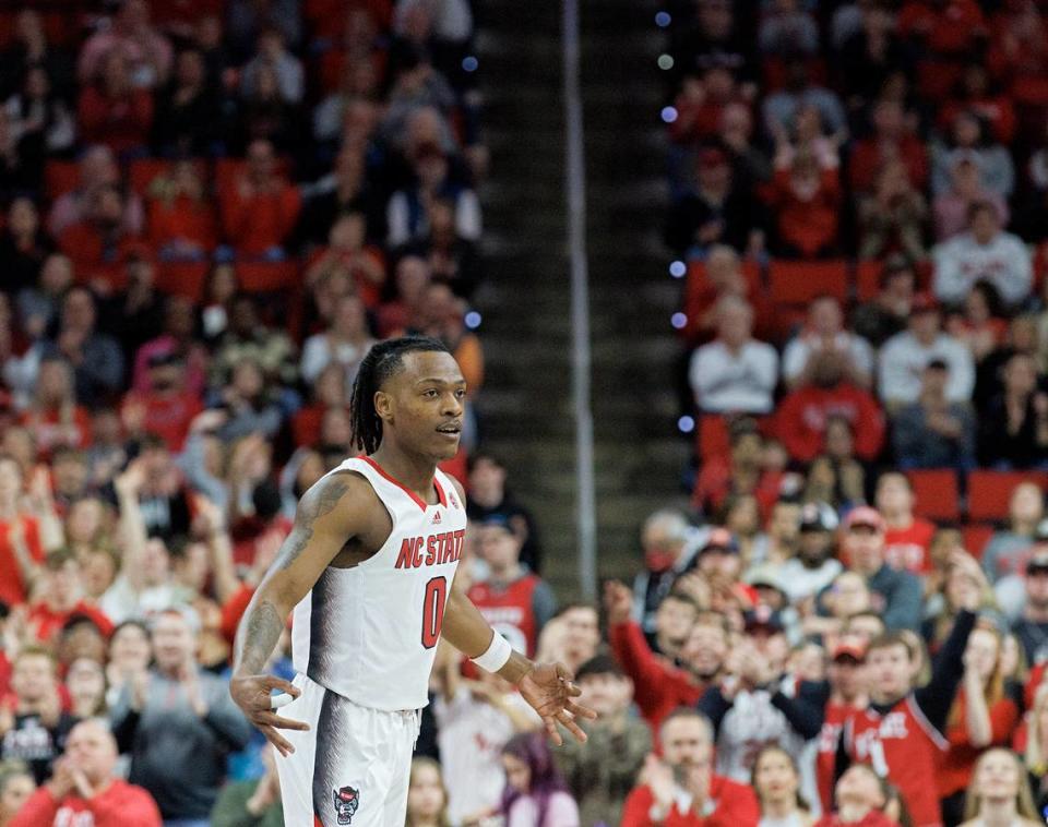 N.C. State’s DJ Horne reacts after knocking down a basket during the first half of the Wolfpack’s game against Georgia Tech on Saturday, Feb. 3, 2024, at PNC Arena in Raleigh, N.C.