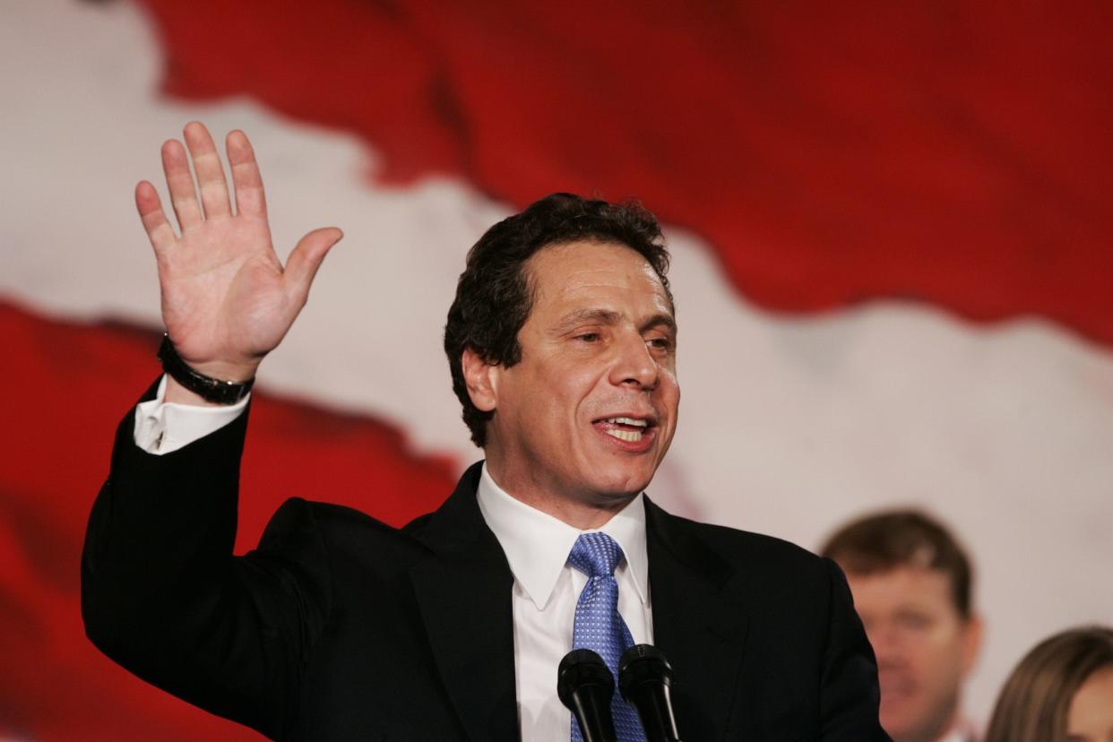 Andrew Cuomo waves as he speaks to supporters at Democratic Headquarters in the Sheraton New York Hotel on election night after winning the race for state attorney general over his Republican opponent, Jeanine Pirro.