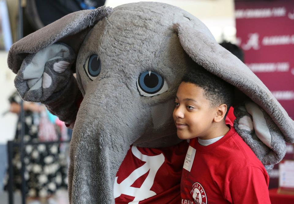 Big Al poses for a photo with Kendall McCants during the Nick's Kids Foundation luncheon Wednesday Aug. 2, 2023, in Bryant-Denny Stadium.