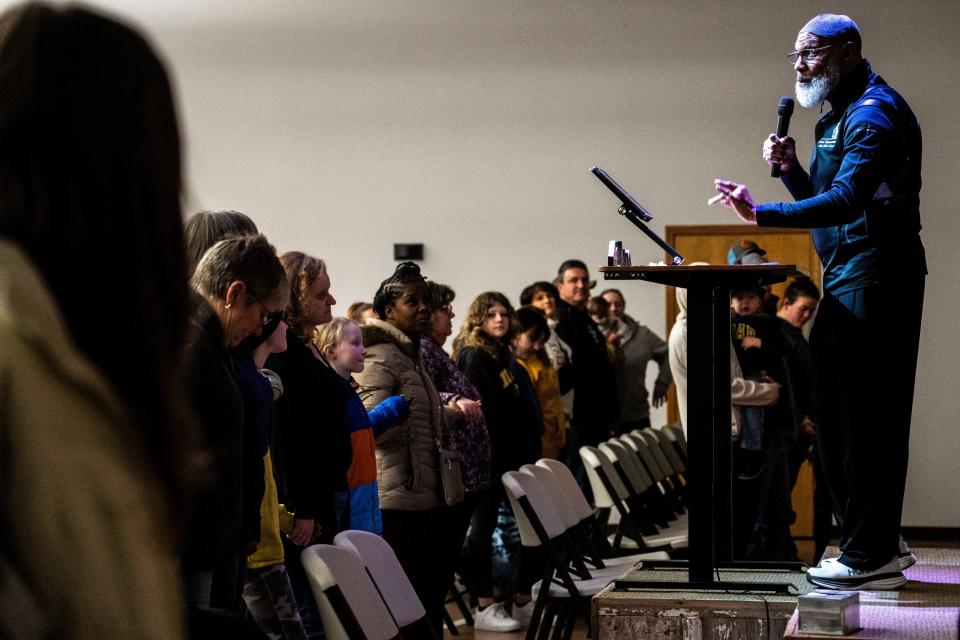 Iowa state Rep. Ako Abdul-Samad of Des Moines speaks to the congregation during a vigil at Crossroads Church in Perry.