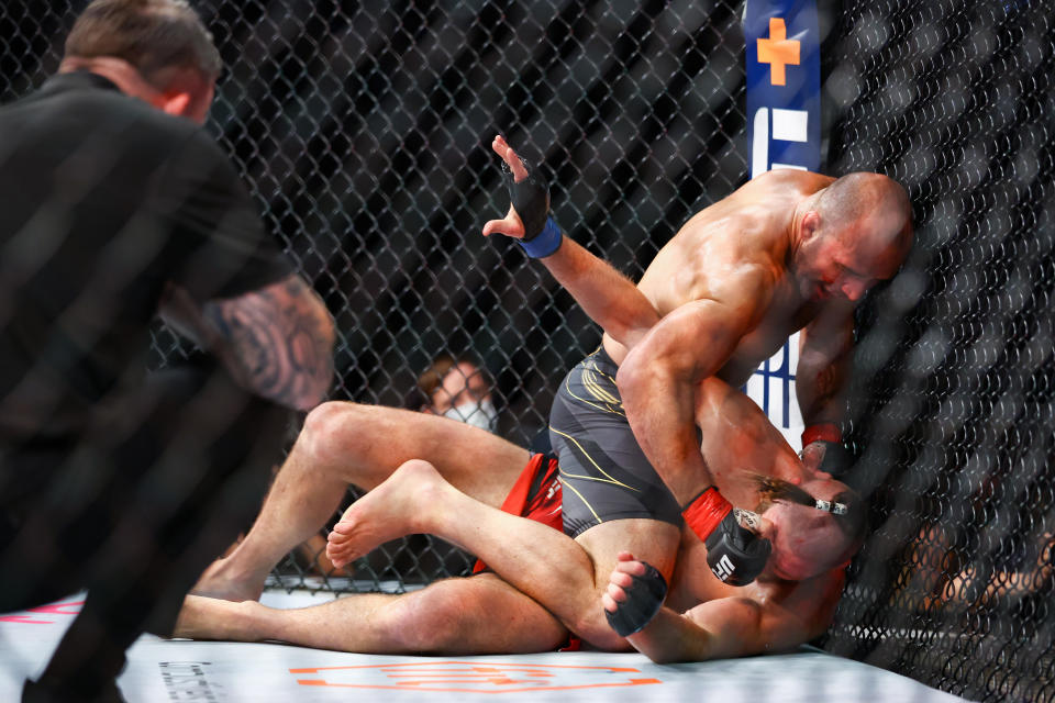 SINGAPORE, SINGAPORE - JUNE 12: Glover Teixeira of Brazil exchanges strikes with Jiri Prochazka of Czech Republic during their light Heavyweight Championship Fight at Singapore Indoor Stadium on June 12, 2022 in Singapore. (Photo by Yong Teck Lim/Getty Images)