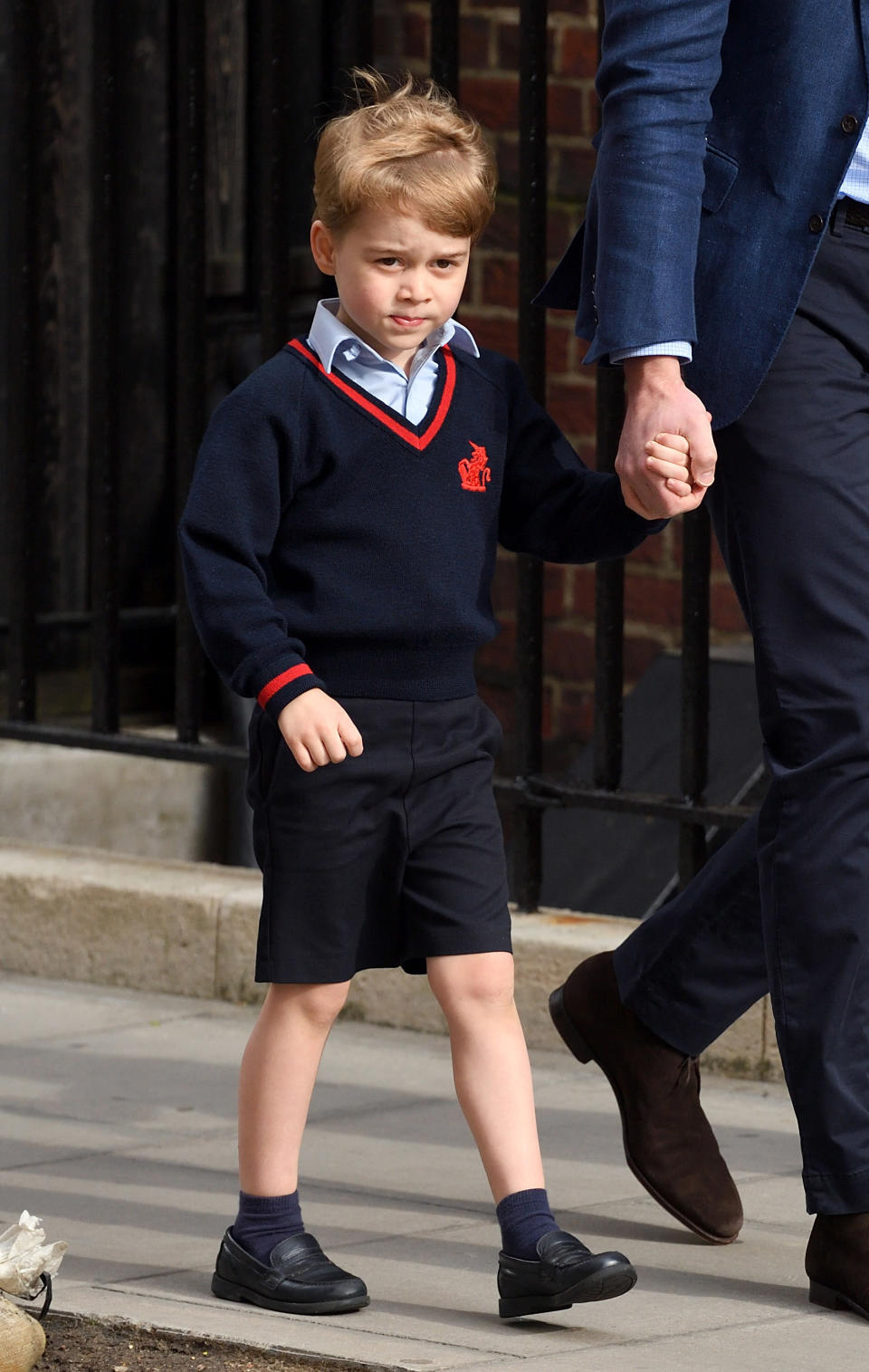 Prince George enters St. Mary’s hospital to meet his newborn brother, Prince Louis. Photo via Getty Images