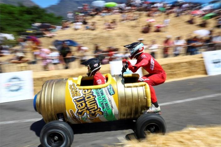 Participants race during the Red Bull Box CartÂ Race challenges in Bo Kaap, one of the iconic neighbourhoods in Cape Town, South Africa, November 6, 2022.