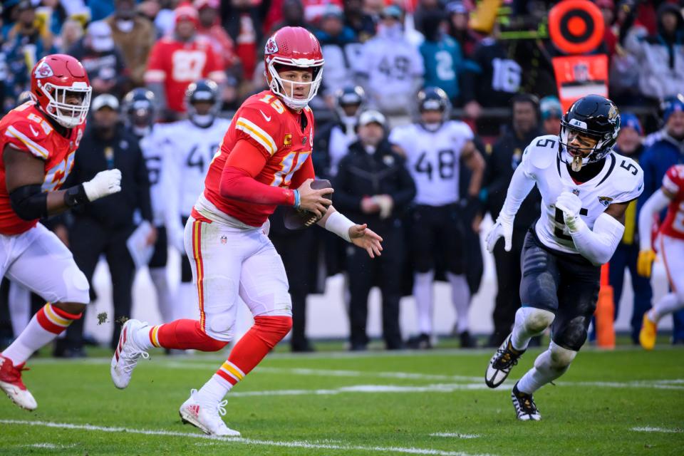 Kansas City Chiefs quarterback Patrick Mahomes (15) is chased by Jacksonville Jaguars safety Andre Cisco during the divisional round.