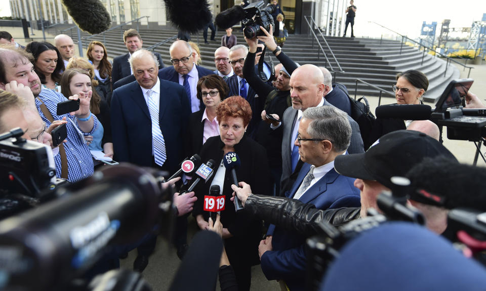 Summit county executive Ilene Shapiro speaks to the media outside the U.S. Federal courthouse, Monday, Oct. 21, 2019, in Cleveland. The nation's three dominant drug distributors and a big drugmaker have reached a $260 million deal to settle a lawsuit related to the opioid crisis just as the first federal trial over the crisis was due to begin Monday. (AP Photo/David Dermer)