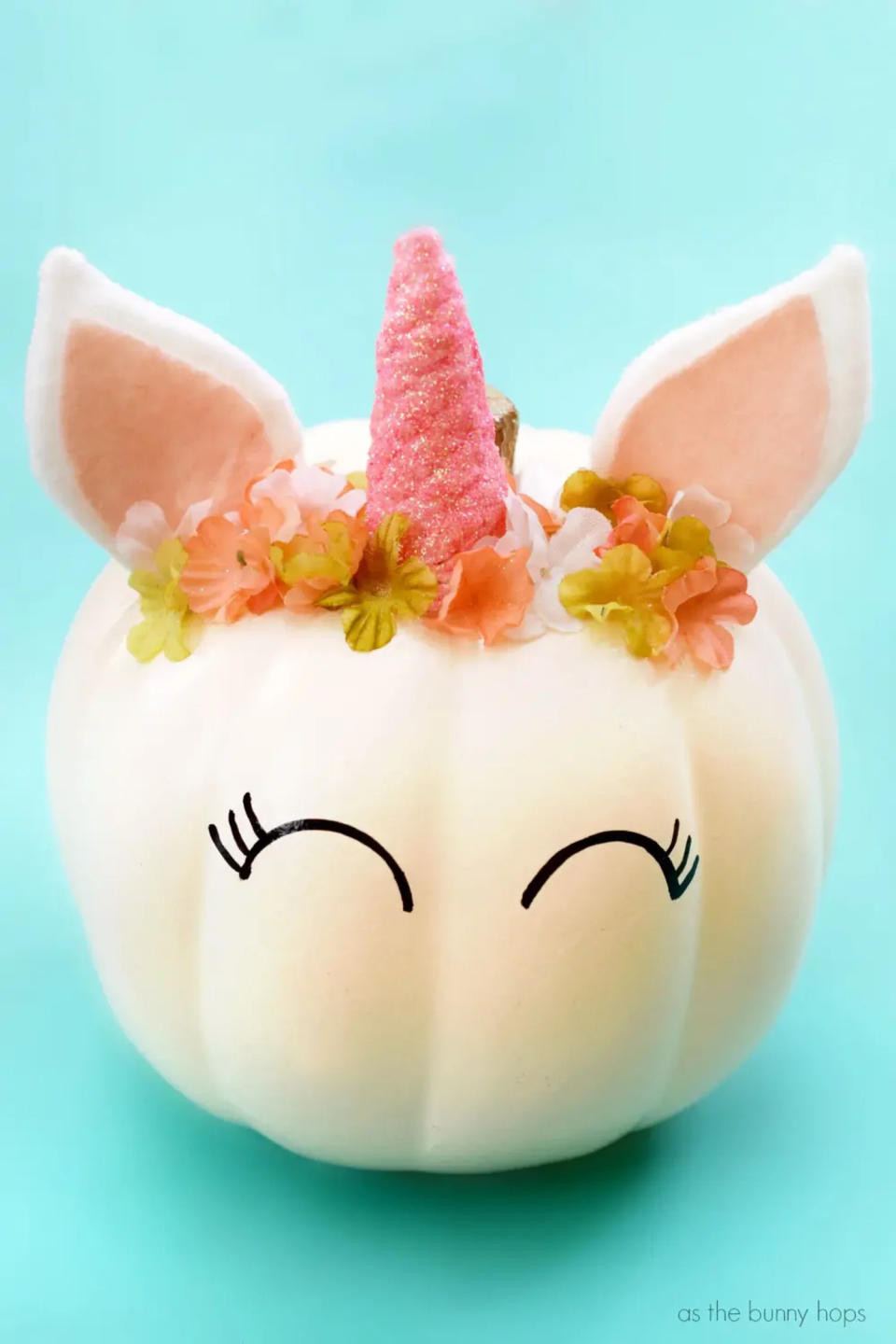 cream pumpkin decorated to look like a unicorn (As the Bunny Hops )