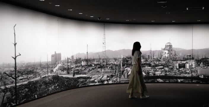 A visitor to the Hiroshima Peace Memorial Museum views a photo of the aftermath of the 1945 bombing. <a href="https://www.gettyimages.com/detail/news-photo/visitor-to-hiroshima-peace-memorial-museum-views-a-large-news-photo/1227916081?adppopup=true" rel="nofollow noopener" target="_blank" data-ylk="slk:Carl Court/Getty Images" class="link ">Carl Court/Getty Images</a>