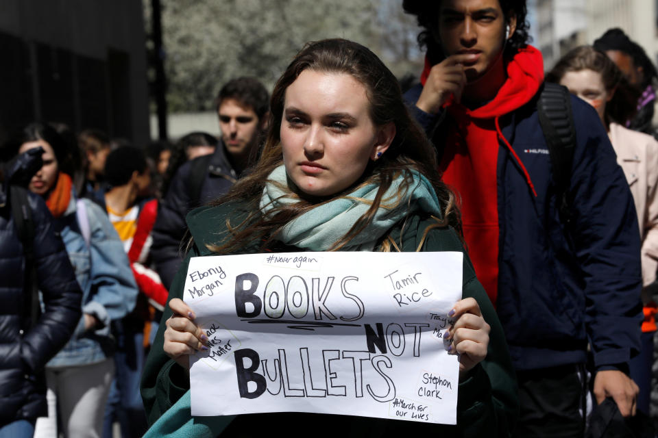 Students from Fiorello H. Laguardia High School march out of their school.&nbsp;