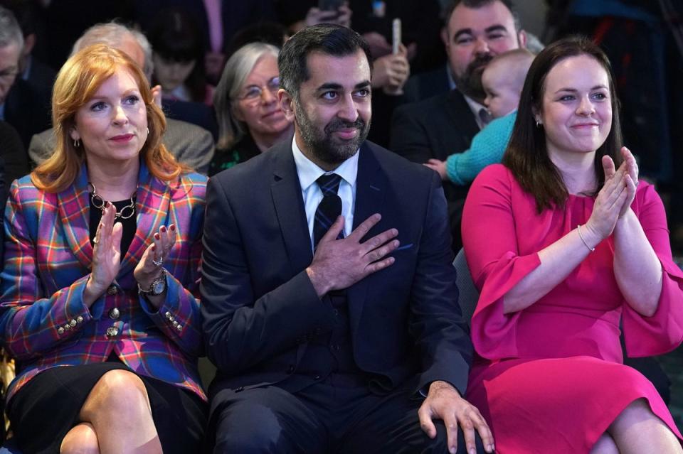 Humza Yousaf (centre) with fellow candidates Ash Regan (left) and Kate Forbes (right) at Murrayfield Stadium in Edinburgh, after Mr Yousaf was announced as the new Scottish National Party leader (PA)