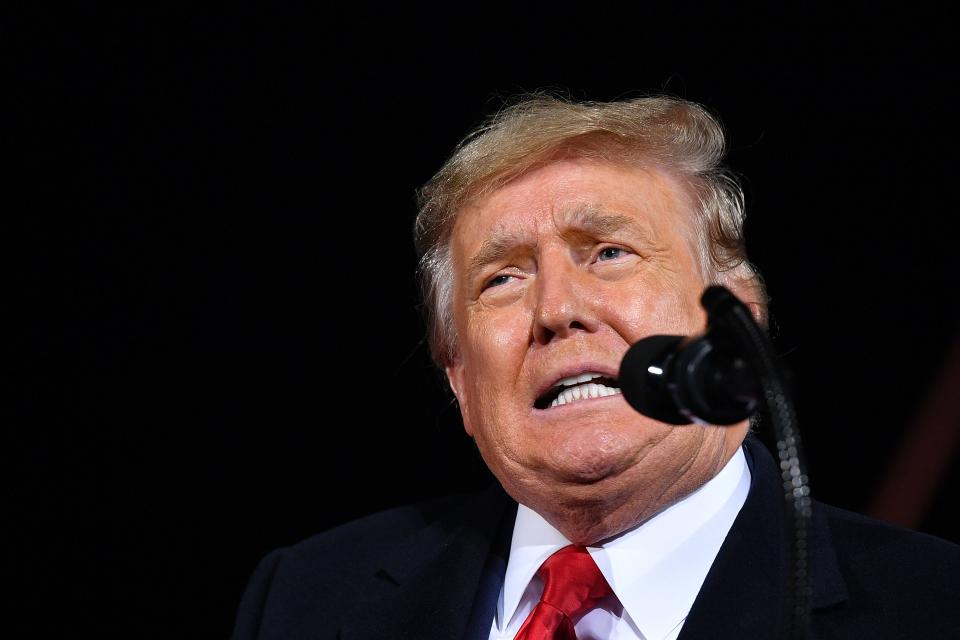 US President Donald Trump speaks during a rally in support of Republican incumbent senators Kelly Loeffler and David Perdue ahead of Senate runoff in Dalton, Georgia on January 4, 2021. - President Donald Trump, still seeking ways to reverse his election defeat, and President-elect Joe Biden converge on Georgia on Monday for dueling rallies on the eve of runoff votes that will decide control of the US Senate. Trump, a day after the release of a bombshell recording in which he pressures Georgia officials to overturn his November 3 election loss in the southern state, is to hold a rally in the northwest city of Dalton in support of Republican incumbent senators Kelly Loeffler and David Perdue. (Photo by MANDEL NGAN / AFP) (Photo by MANDEL NGAN/AFP via Getty Images)