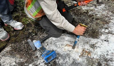 Figure 3 – Sampling of a Pegmatite at Mazerac in Quebec (CNW Group/Power Metals Corp.)