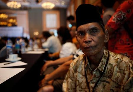 Abdurrashim, 72, who said he served 12 years in detention in the 1960s and 70s for links to the communist party, poses for a photograph while attending a state-backed event on the controversial anti-communist purge of 1965 in Jakarta, Indonesia April 19, 2016. REUTERS/Darren Whiteside