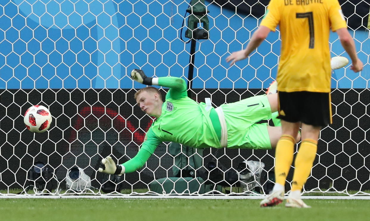 Jordan Pickford makes a save as he finished another superb World Cup campaign with a fine display against Belgium in Saint Petersburg