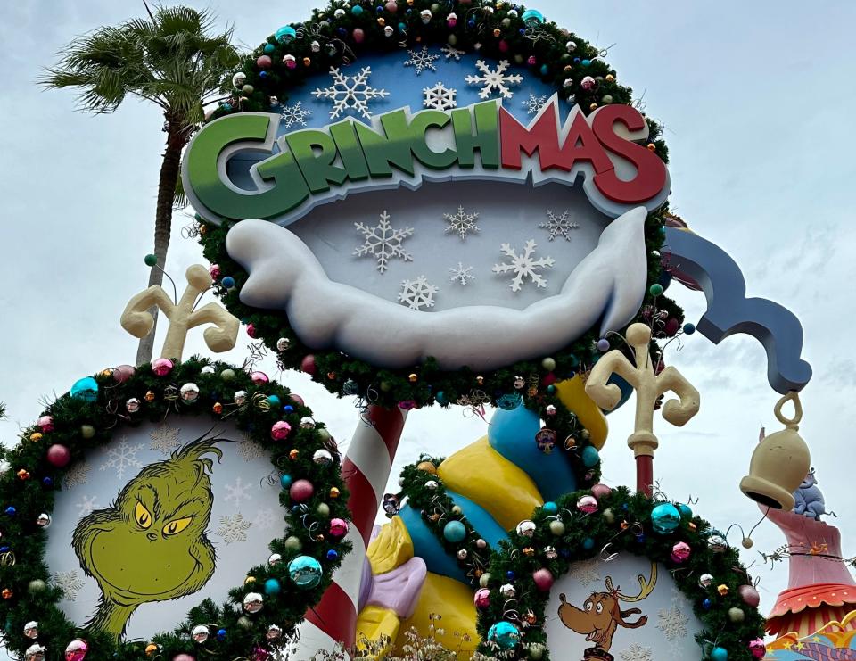 Grinchmas sign surrounded by baubles and faux pine at Universal