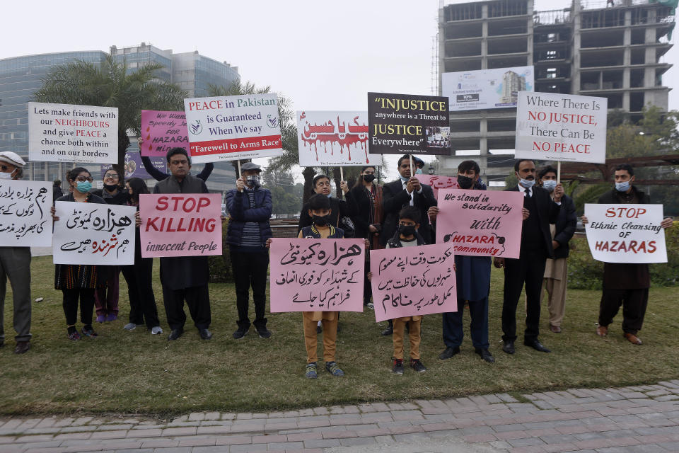 Supporters of a civil society organization hold a demonstration to protest against the killing of coal mine workers by gunmen near the Machh coal field, in Lahore, Pakistan, Friday, Jan. 8, 2021. Pakistan's prime minister Friday appealed the protesting minority Shiites not to link the burial of 11 coal miners from Hazara community who were killed by the Islamic State group to his visit to the mourners, saying such a demand amounted to blackmailing the country's premier. (AP Photo/K.M. Chaudary)