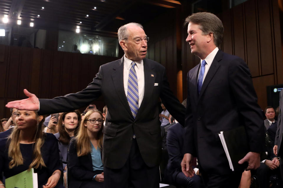 U.S. Supreme Court nominee judge Brett Kavanaugh arrives with Judiciary Committee Chairman Sen. Chuck Grassley (R-IA) for the second day of his confirmation hearing on Capitol Hill in Washington, U.S., September 5, 2018. REUTERS/Chris Wattie