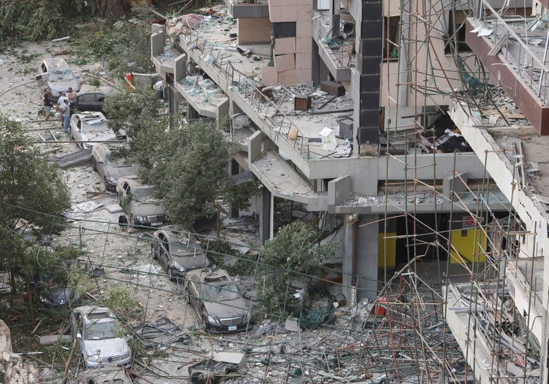 FILE PHOTO: People inspect the damage near the site of Tuesday's blast in Beirut's port area